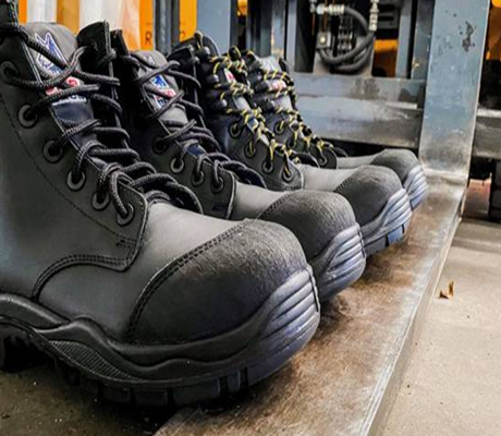 Black industrial safety boots with reinforced toe by Safety Shoes Manufacturer – DSK Safety